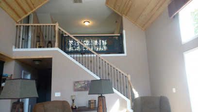 Decorative railing panel with bear and pines